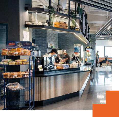 Modern staff cafeteria counter with integrated service and seating areas