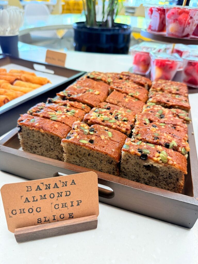 Banana almond choc chip slice served at a staff tea break
