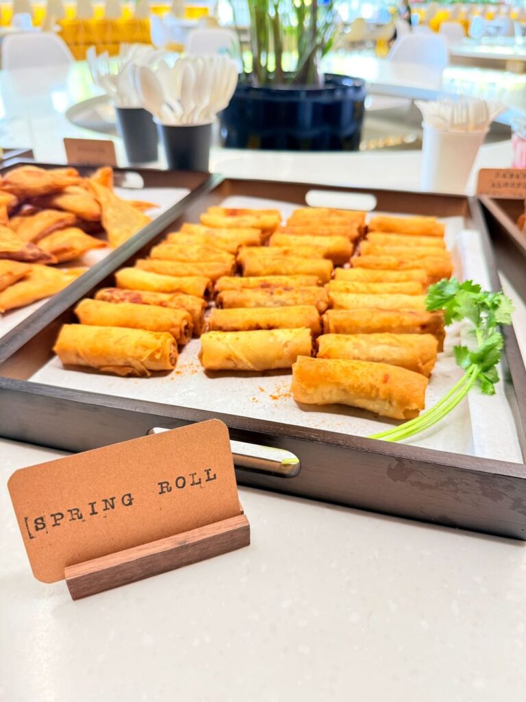 Spring rolls served on a tray at a staff tea break