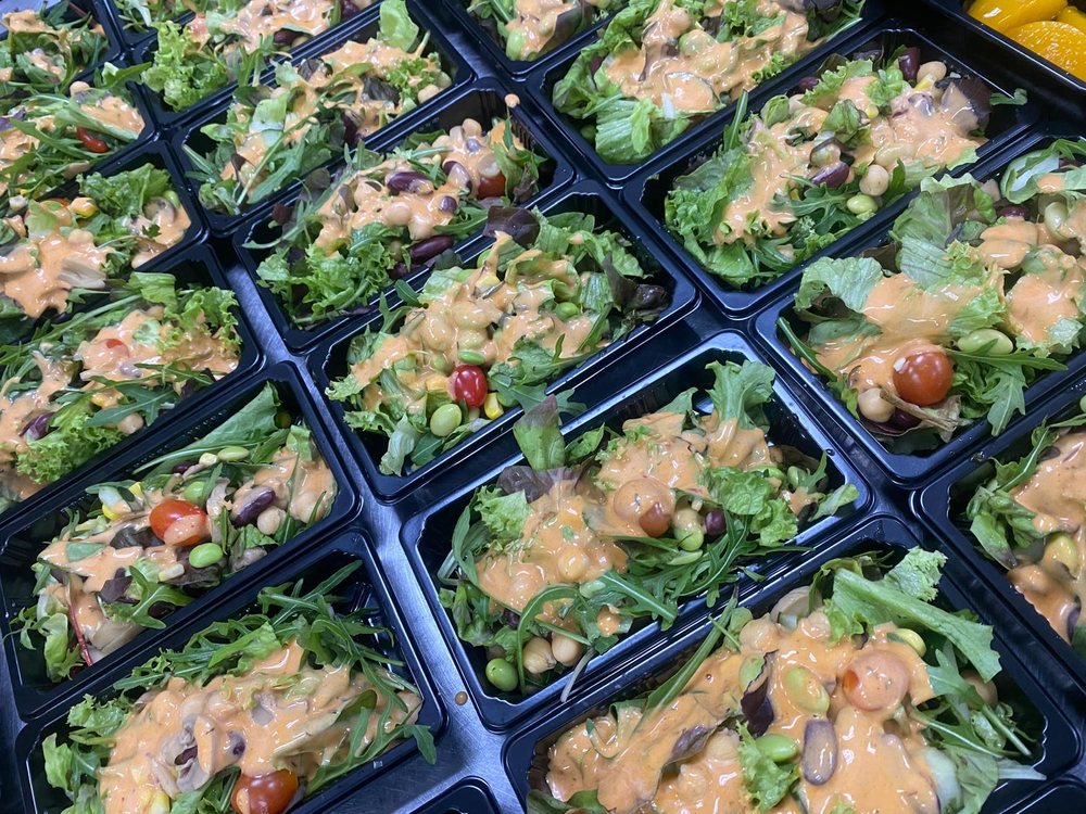 Mixed bean salad bowls with leafy greens, chickpeas, edamame and cherry tomatoes