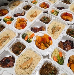Bento sets with rice, braised meats, dumplings and vegetables