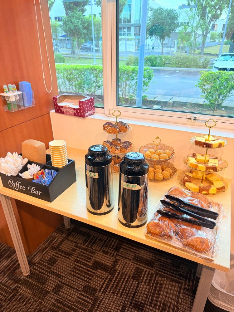 Coffee and tea station with pastries, sesame balls and marble cake for a meeting